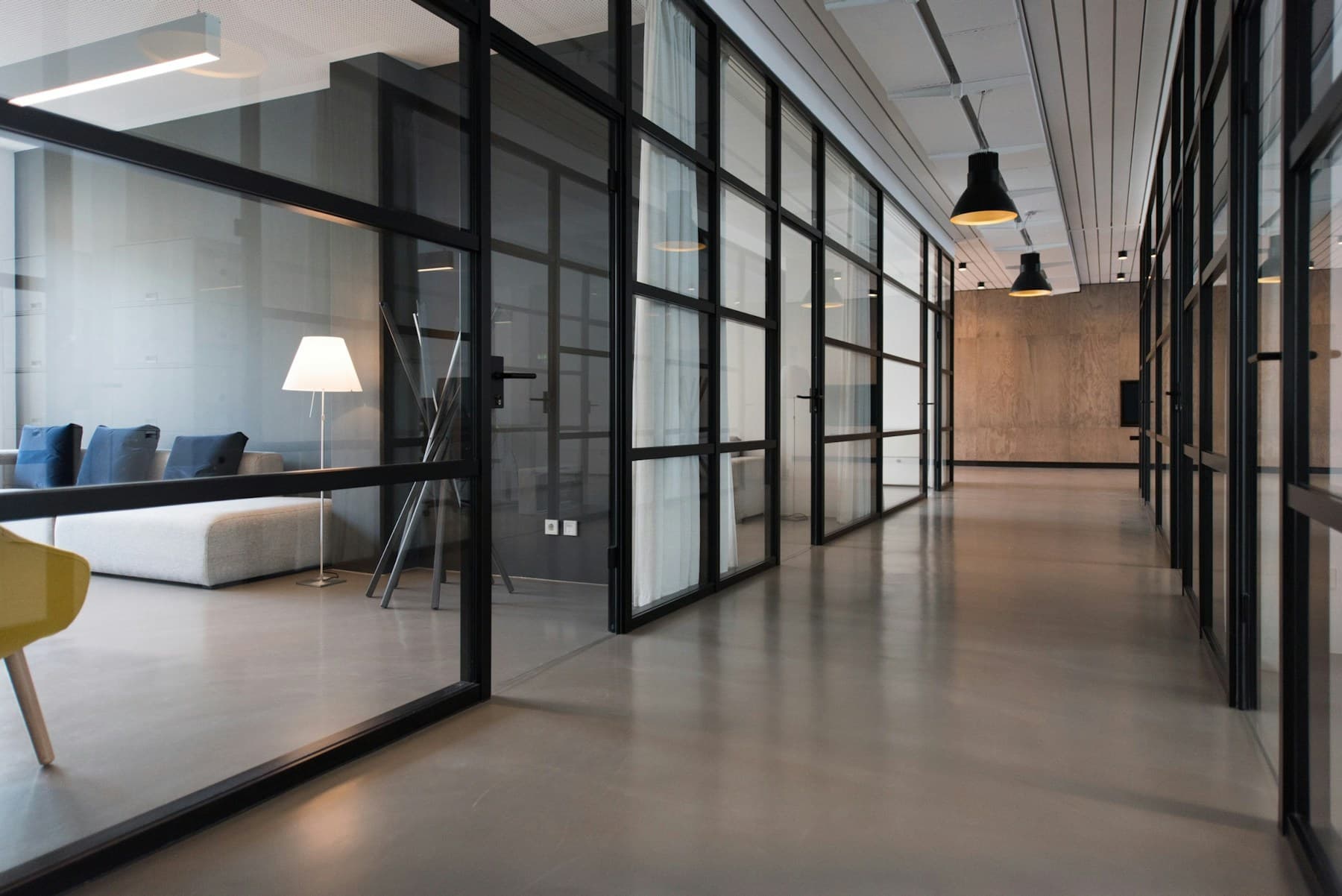 Modern office architecture with glass rooms and clean lines